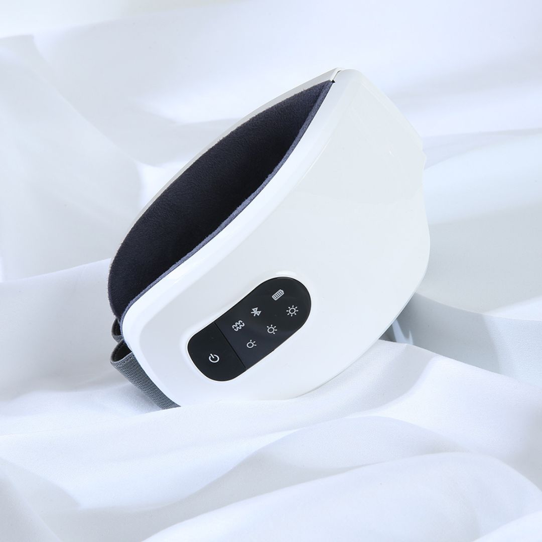 Massaging and heating eye mask